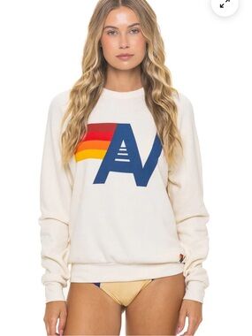 Aviator Nation Cream Crewneck with Navy AV Logo and Red-Orange-Yellow Stripe